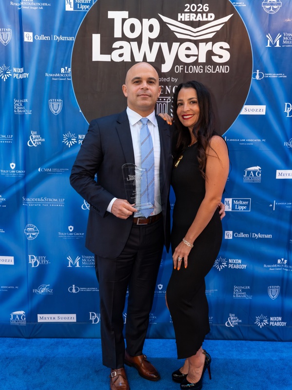 Jason Shapiro holding his award at the 2026 Herald Top Lawyers of Long Island event